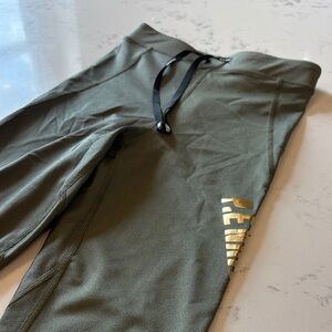 P.E Nation Olive Leggings with Black and Gold Details